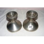 A pair of Norwegian metal candlesticks.