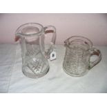 Royal Doulton, a glass water jug measuring 9.25" tall & a smaller example (unmarked) measuring 6.