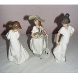 Nao, three porcelain figurines, each of girls, the largest 8.75" tall.