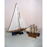 The J-Class Yacht & Endeavour, two scale wooden models, the largest measuring 26" tall.