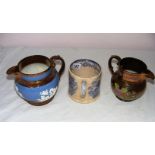 Two Victorian lustre jugs and an early 20th century blue and white printed mug.