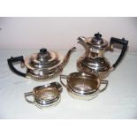A four piece silver plated tea service with semi gadrooned decoration.