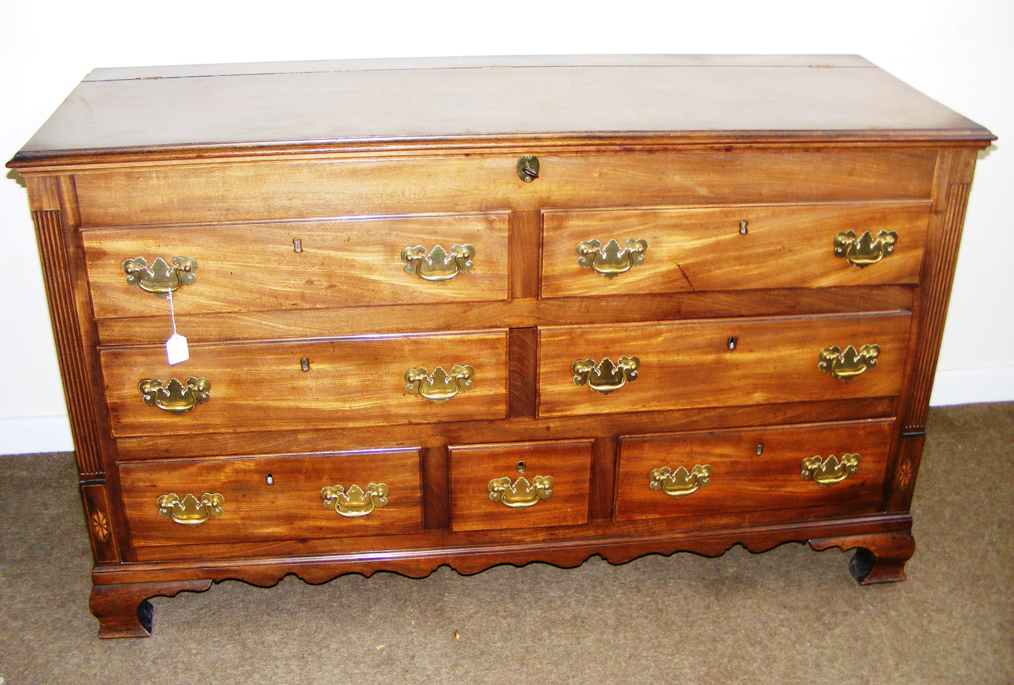 A Victorian mahogany 7 compartment chest of drawers with decorative brass handles,