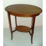 Edwardian, a mahogany two tiered oval inlaid hall table, measuring 26" wide.