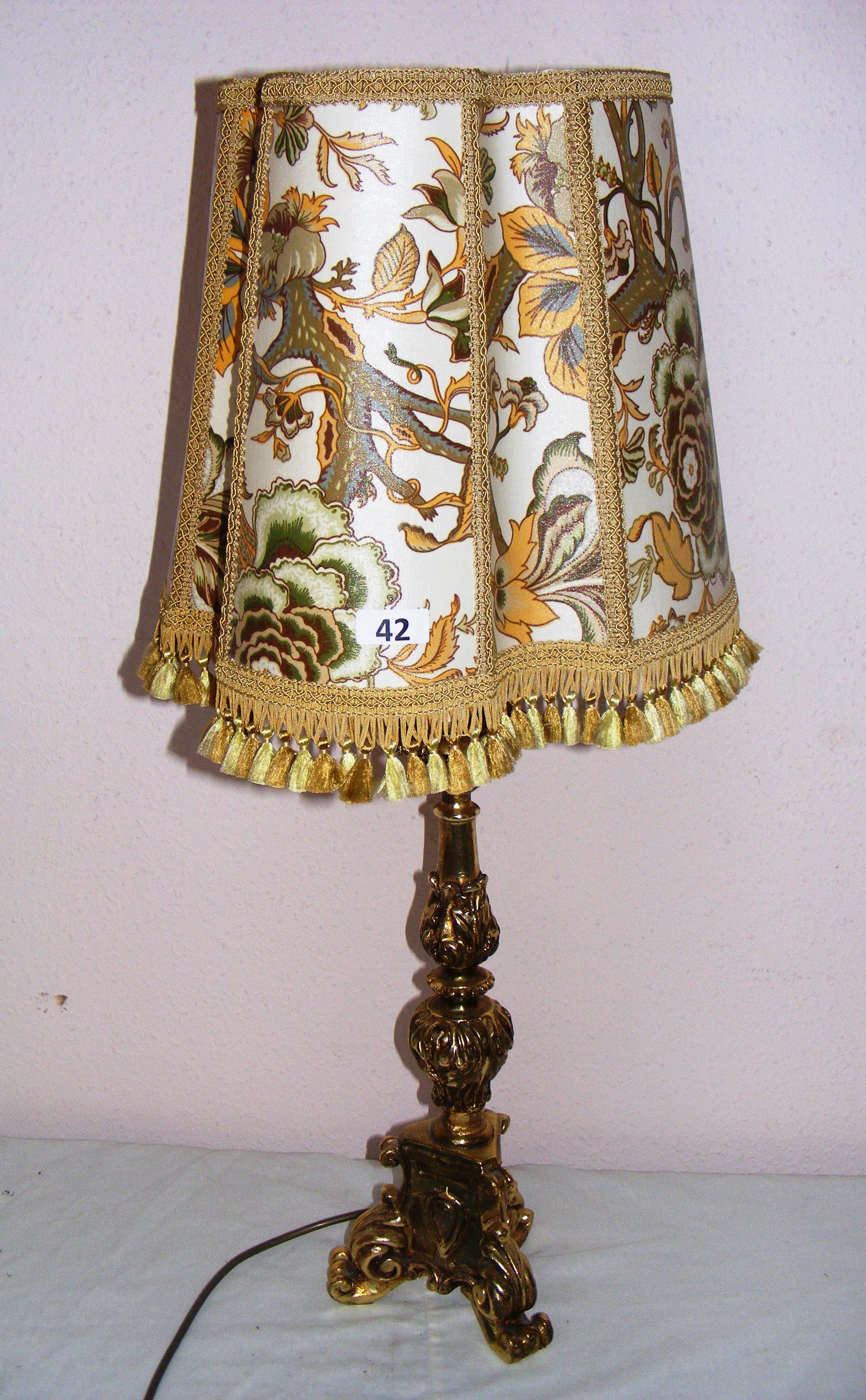 Georgian style, a table lamp, in a carved gilt material, possibly wood,