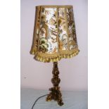 Georgian style, a table lamp, in a carved gilt material, possibly wood,