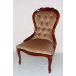 A Victorian style reproduction upholstered bedroom chair measuring 34" tall.