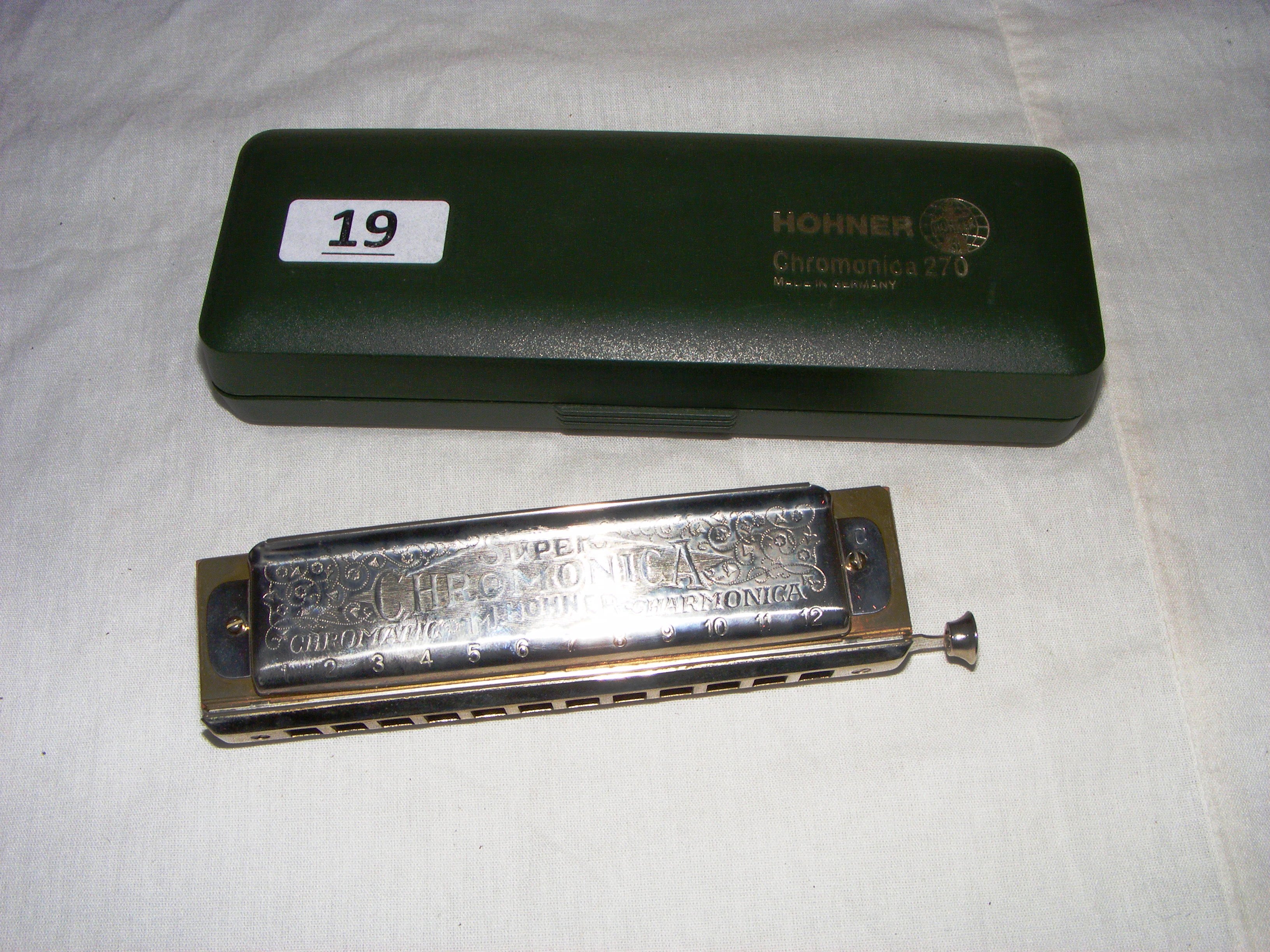 A Hohner, 270 Super Chromonica, harmonica in original box.
