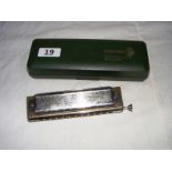 A Hohner, 270 Super Chromonica, harmonica in original box.