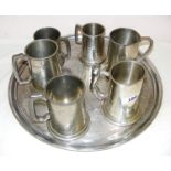 A tray of assorted pewter and metal tankards.
