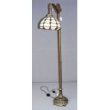 A modern cast metal Tiffany style standard lamp measuring 63" tall.