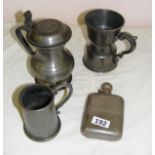 A selection of modern pewter and a spirit flask.