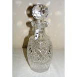 A good quality Waterford crystal decanter with a round faceted stopper,