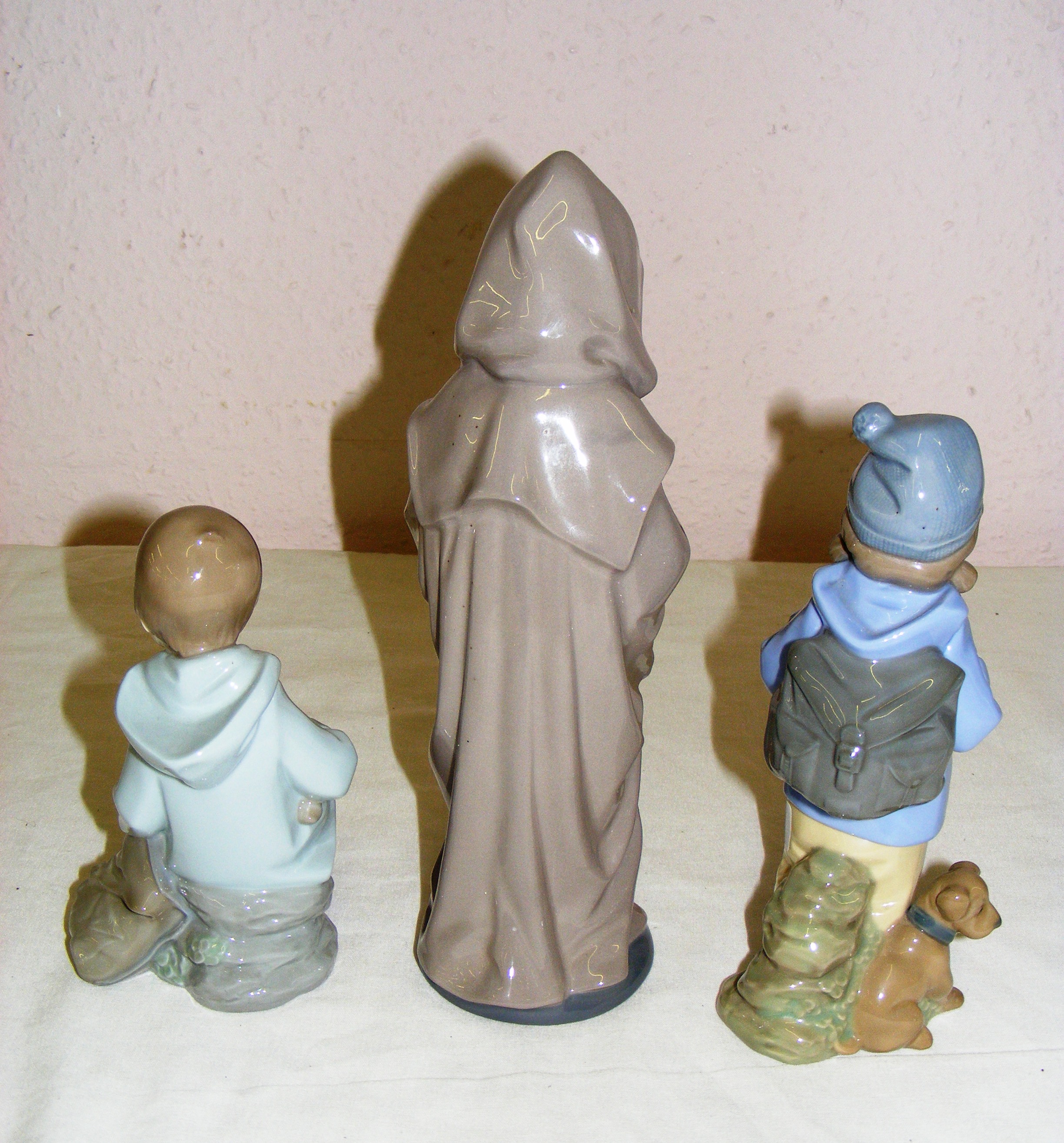 Three porcelain Nao figurines including a boy with a dog hiking, - Image 2 of 3