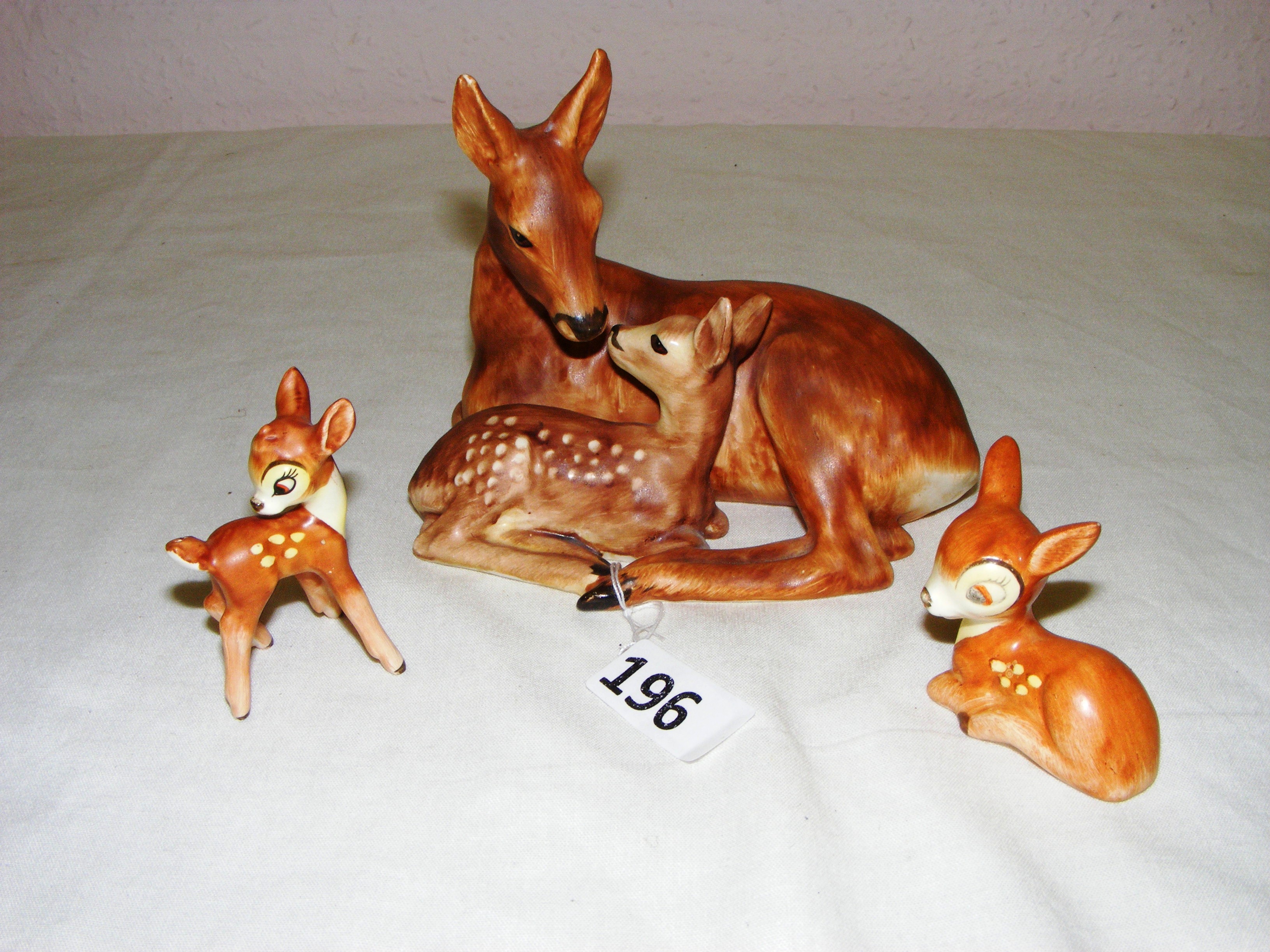 Three Goebel figurines consisting of two small 'Bambi' figurines and a Deer and Fawn figurine,