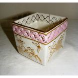 A Victorian Worcester reticulated pot, painted in a blush ivory and pink palette and gilded,