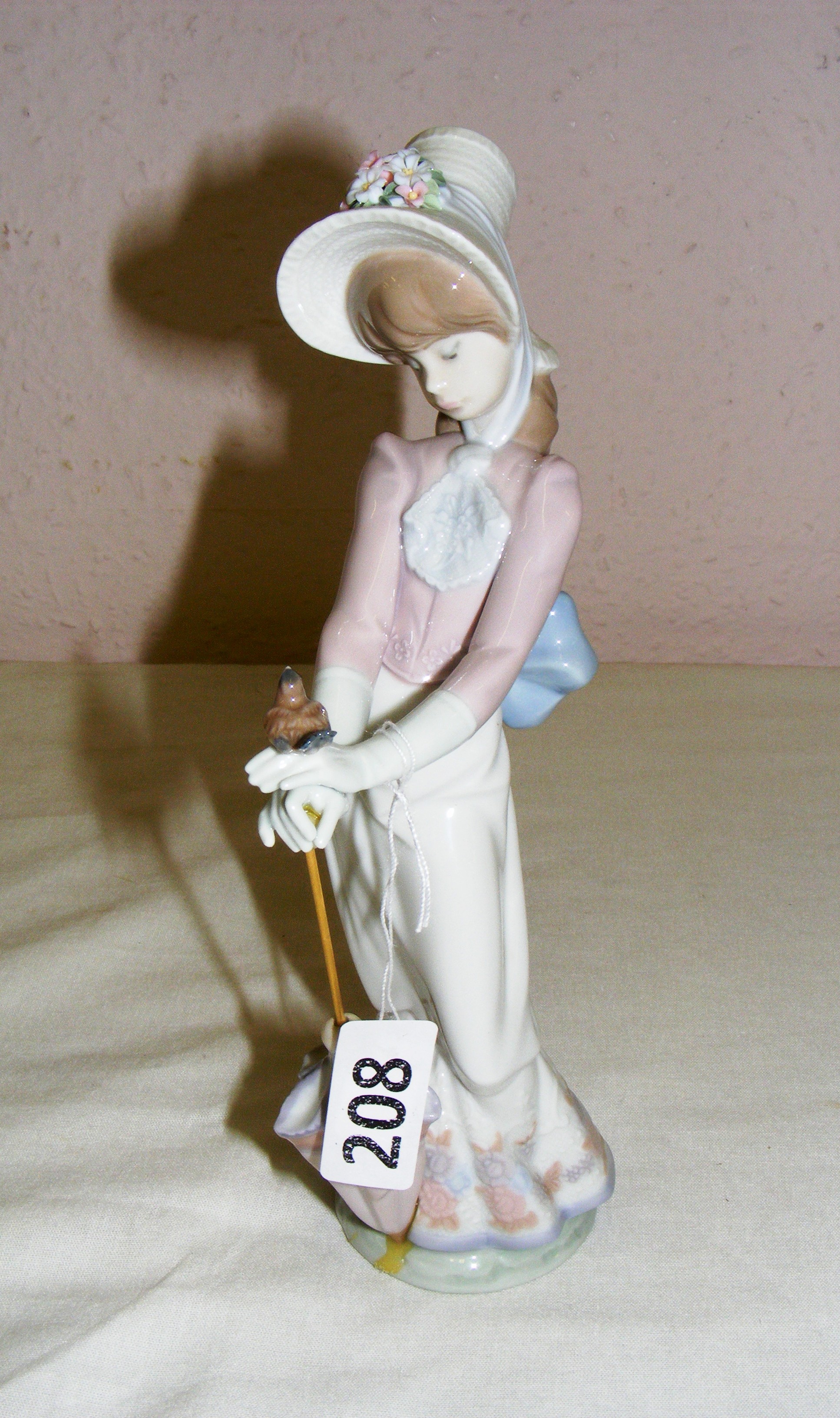 A Lladro figurine, titled "Garden Song" #7618 (impressed to the base).