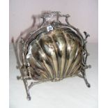 A Victorian silver plated plate warmer shaped as a scallop shell,