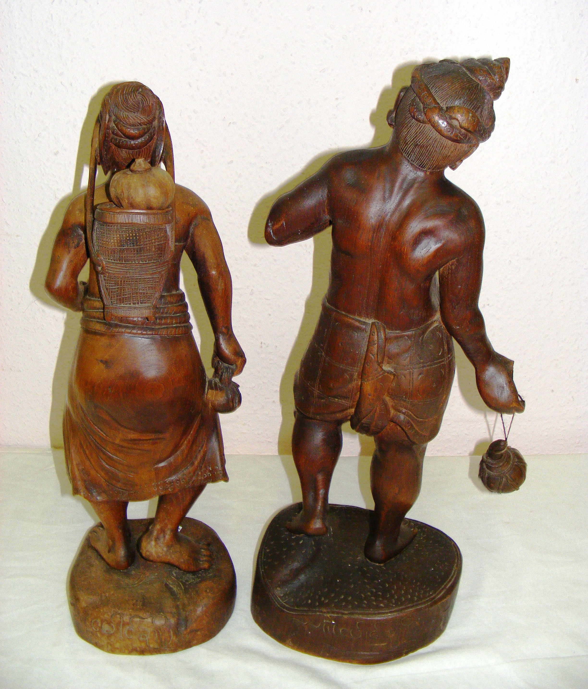 A pair of Indian carved hardwood figures of a man and woman each measuring 23" tall. - Image 2 of 2