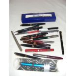 A large quantity of pens including a boxed Waterman example etc and a Dunlop pressure gauge.