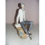 A Lladro porcelain figurine #4684 Hebrew Student Reading, measuring 11.5" tall.