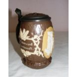 An early 20th century Villeroy & Boch stoneware tankard modelled in the naturalistic form with a