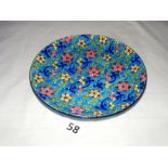 A French Longwy enamel plate measuring 7.25" in diameter.