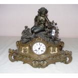 A French spelter mantle clock modelled as a cherub and animals in a Rococo manner, measuring 13.