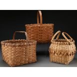 A GROUP OF THREE WOVEN BASKETS, 20TH CENTURY