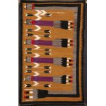 A FINE SOUTHWEST NAVAJO “YEI” HANDWOVEN WOOL RUG