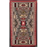 A FINE SOUTHWEST NAVAJO HANDWOVEN WOOL RUG