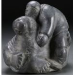 SOAPSTONE CARVED INUIT FIGURE WITH WALRUS