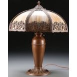 A BENT PANEL SLAG GLASS LAMP, EARLY 20TH CENTURY