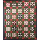 A 19TH CENTURY HAND STITCHED QUILT