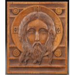 A CARVED RELIEF OAK ICON OF THE HOLY FACE