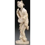 A JAPANESE CARVED IVORY OKIMONO OF A GEISHA, MEIJ