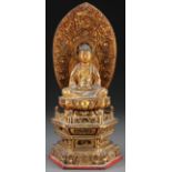 A JAPANESE CARVED AND GILT LACQUER BUDDHA, MEIJI