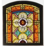 A GROUP OF FOUR STAINED AND LEADED GLASS PANELS