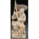 A JAPANESE CARVED IVORY OKIMONO, MEIJI PERIOD. O