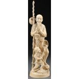 A VERY FINE JAPANESE CARVED IVORY OKIMONO OF A FI