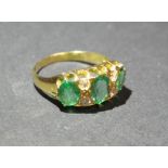 An 18ct. Yellow Gold Emerald and Diamond