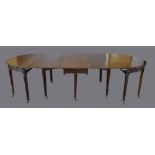 A 19th Century Mahogany Extending Dining Table comprising a pair of demi-lune ends and a central