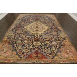 A North West Persian Woollen Carpet with a central medallion within an all over design upon a blue