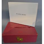 An Early 20th Century Red Leather Jewellery Box together with a Burberry Games Compendium