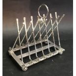 A Silver Plated Six Division Toast Rack in the form of Golf Clubs and Balls