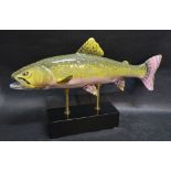 A Porcelain Painted Model of a Salmon upon an ebonised rectangular stand,