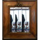 A Late 19th Early 20th Century French Rectangular Wall Mirror with a carved cresting and bevelled