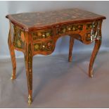 A French Kingwood Gilt Metal Mounted and Marquetry Inlaid Writing Table of shaped form with five