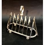 A Silver Plated Six Division Toast Rack in the form of cricket bats,