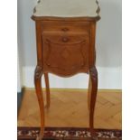 A 19th Century French Bedside Cabinet with a variegated marble top above a drawer and cupboard door,
